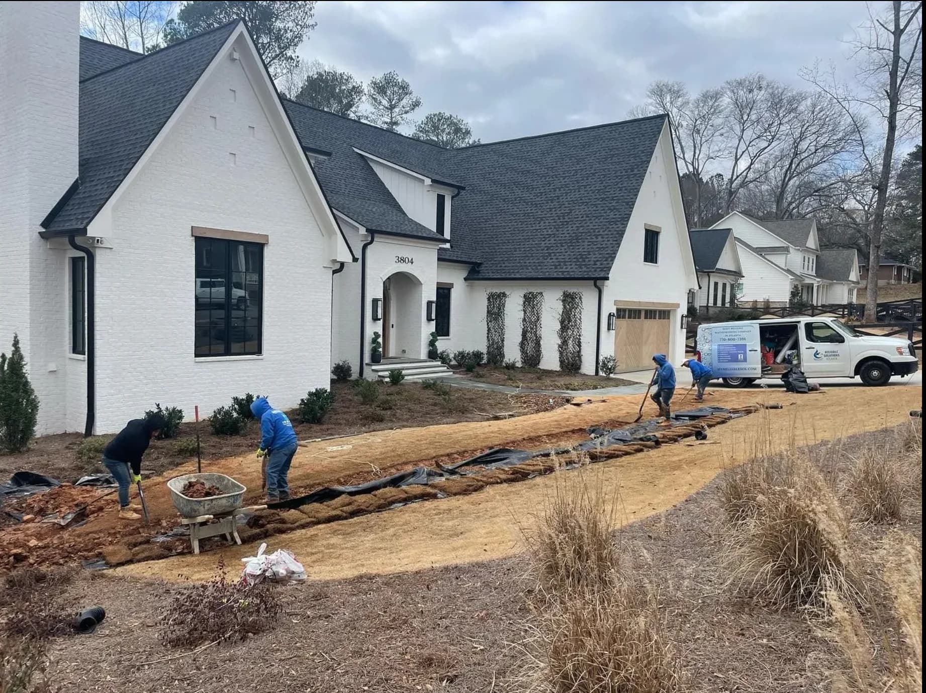 Reliable Solutions Atlanta crew installing drainage system