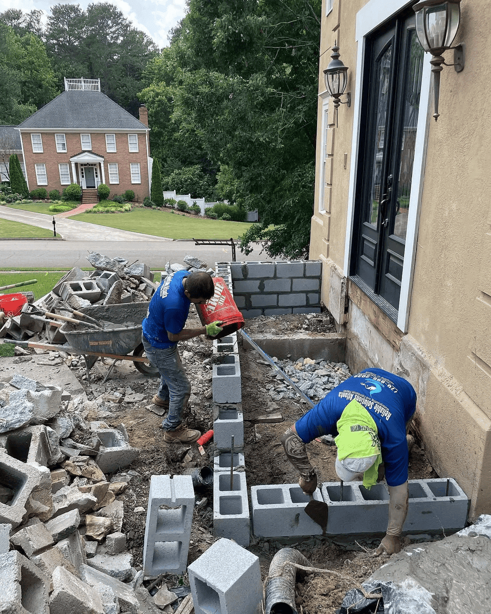 Foundation repair crew working on an Atlanta home
